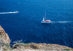 Catamaran and speedboat out at sea