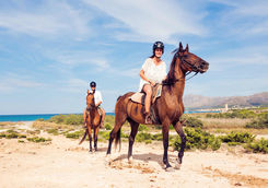 Couple horseback riding
