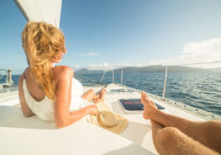 Couple relaxing on a catamaran