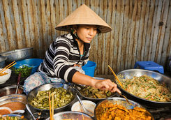 vietnamese food vendor on local market