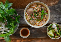 pho vietnames beef soup on a wooden background