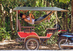 man chilling hammock of tourist carriage