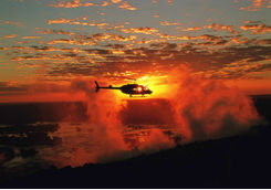 Helicopter over the Victoria Falls at sunset