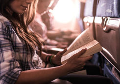 women reading in a plane