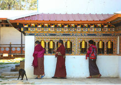 womens with praying wheels