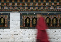 monk and praying wheels