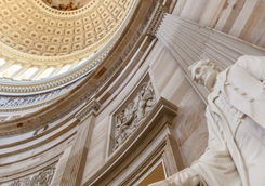 Capitol building rotunda with a sculpture of Abraham Lincoln