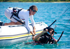 Child learning to windsurf in Antigua