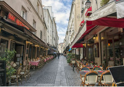 Empty dining tables and chairs in Paris