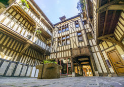 Medieval courtyard surrounded by half medieval houses