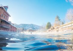 Swimming in outdoor hot springs pool