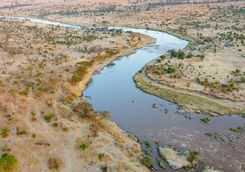 Mara river winding across the Serengeti savanna in Tanzania