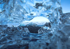 Blue icebergs floating in the lagoon