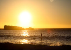 Paddle boarding on sunset