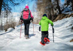 Woman and child snowshoeing outdoor