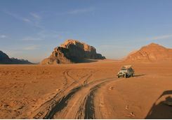 Car in Wadi Rum with Rock Formations