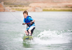 Child learning to wake-board