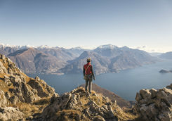Hiker on top of the mountain above Lake Como