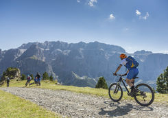 Mountain biker is joining mountain bikers on a ride in the Dolomites