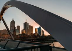 Melbourne cityscape framed by walker pedestrian