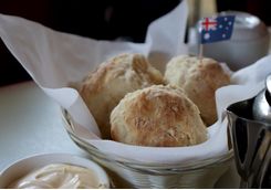 Scone with butter and jam and an Australian flag