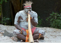 Aboriginal playing didgeridoo