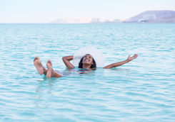 woman floating dead sea