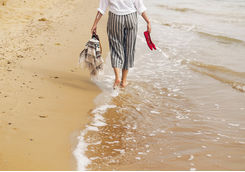 woman walking on beach