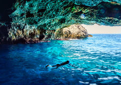 swimming in sea cave
