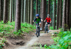 children biking forest