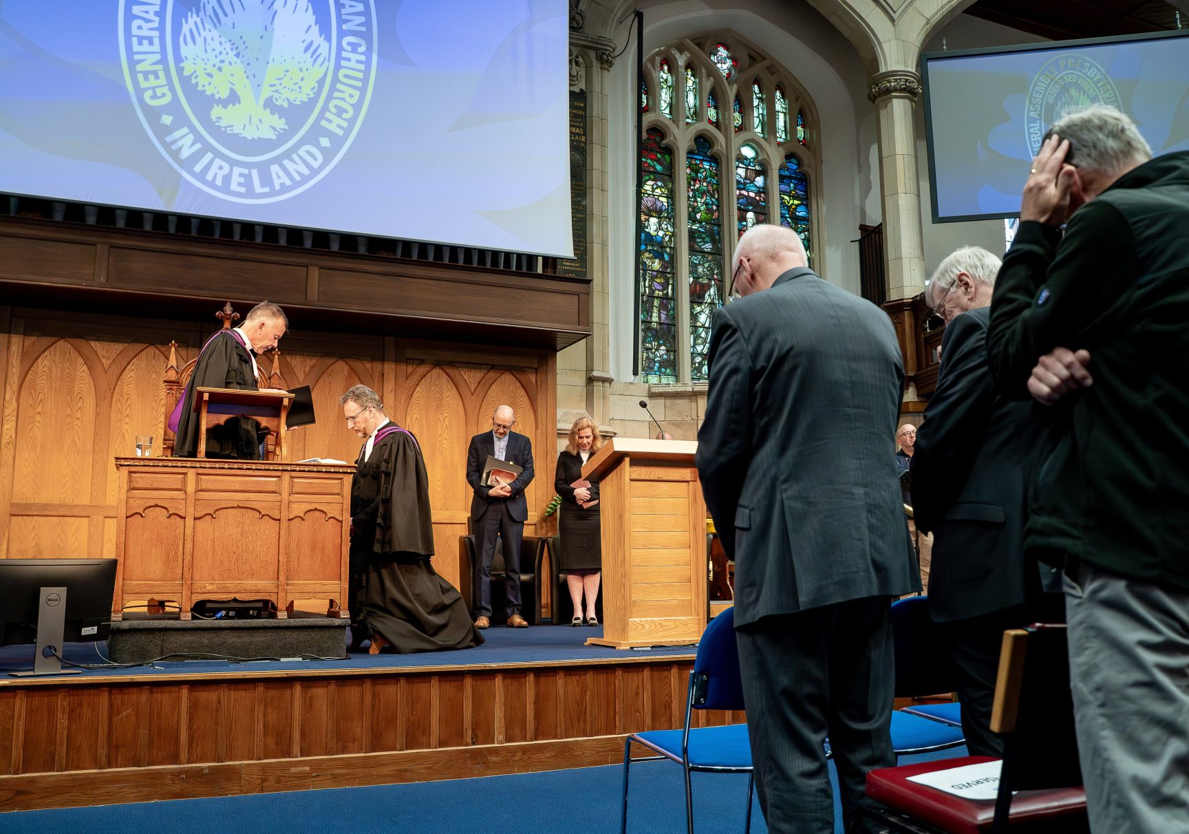 GA26 3 Rt Rev Dr Richard Kerr kneeling during his installation service as Moderator as Dr Richard Murray prays for him 20260611 Credit Matthew Audley JPG