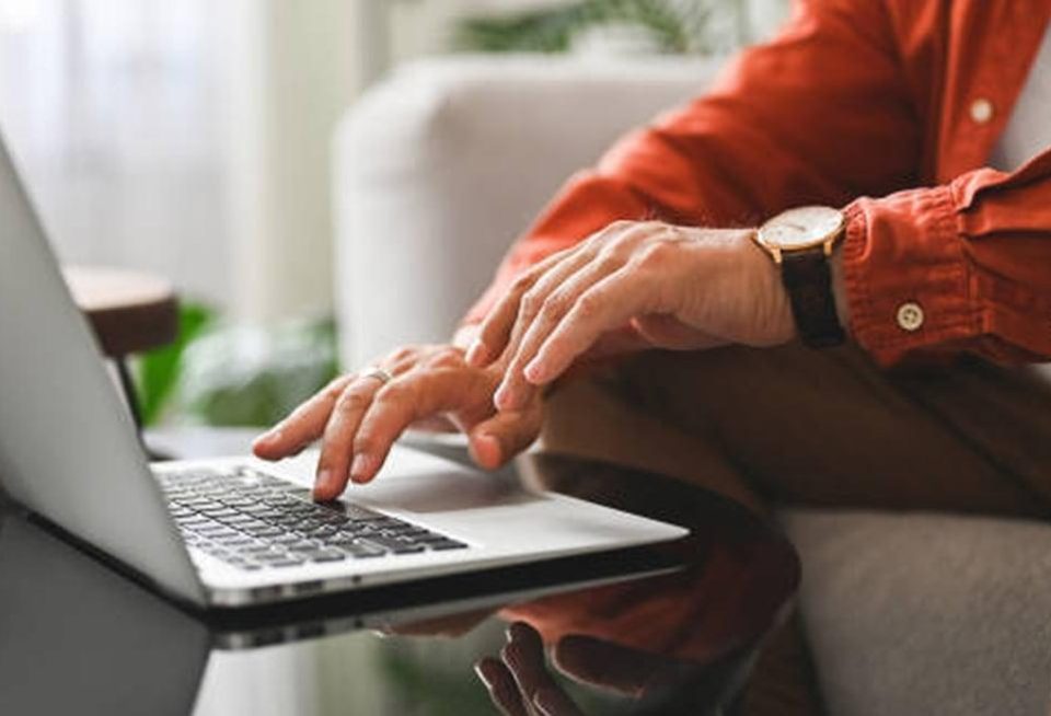 Person using the computer sitting down