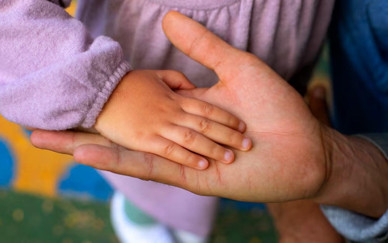 Small hand holding hand