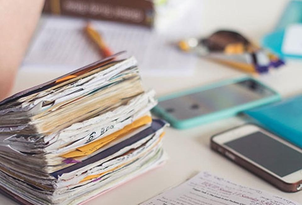 Book phone pens sitting on desk table