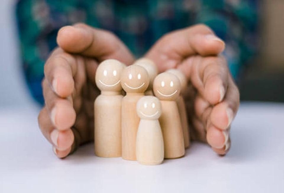 Person with hands around family or friends