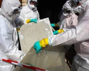 Asbestos Awareness training nationwide from project skills solutions, men in protection moving asbestos