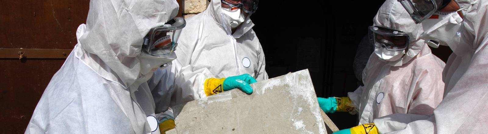 Asbestos Awareness training nationwide from project skills solutions, men in protection moving asbestos