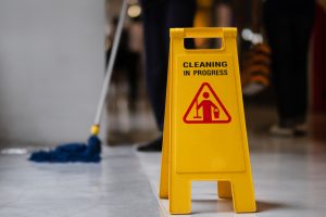 Floor cleaning sign, mop and floor cleaning. 