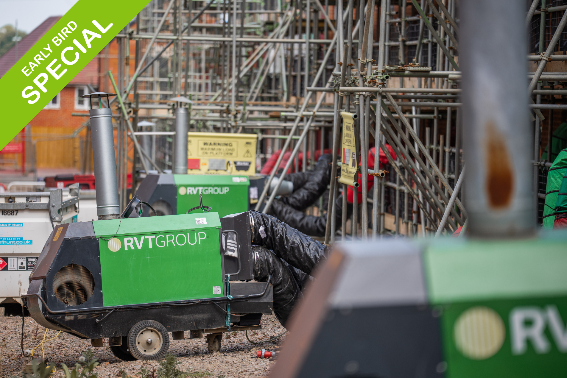 Oil fired heater providing warm air to a construction site project.