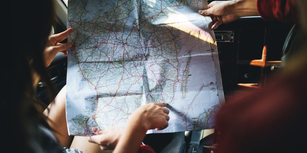 Friends,Reading,Map,Traveling,Destination,Camping,Concept