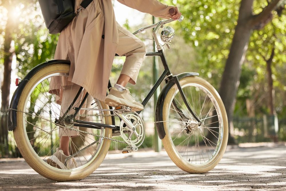 Bicycle,,Closeup,And,Feet,Of,Casual,Cyclist,Travel,On,A