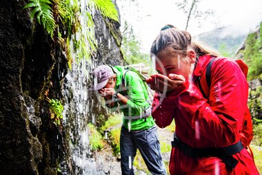 Ida Nilsen and Kyrre Buxrud enjoying fresh glacier water close to Åkrafjorden  Hordaland  Norway.