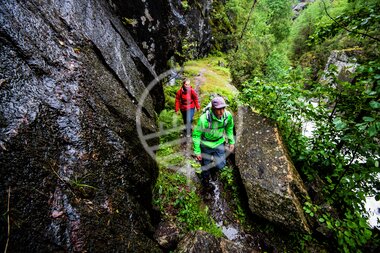 Ida Nilsen and Kyrre Buxrud hiking close to Åkrafjorden  Hordaland  Norway.