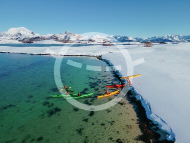 Winter paddling in a kayak at Støtt in Meløy
