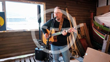 People and music in the boathouse