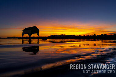 Båthus i Solnedgang
