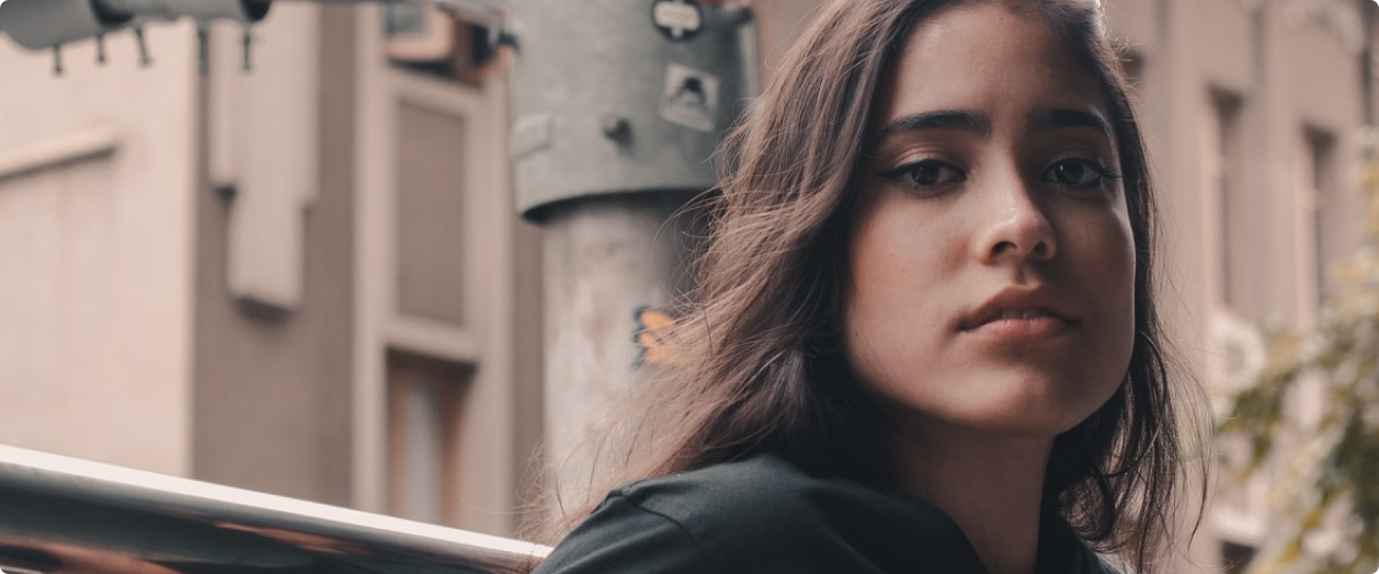 Person leaning against a balcony
