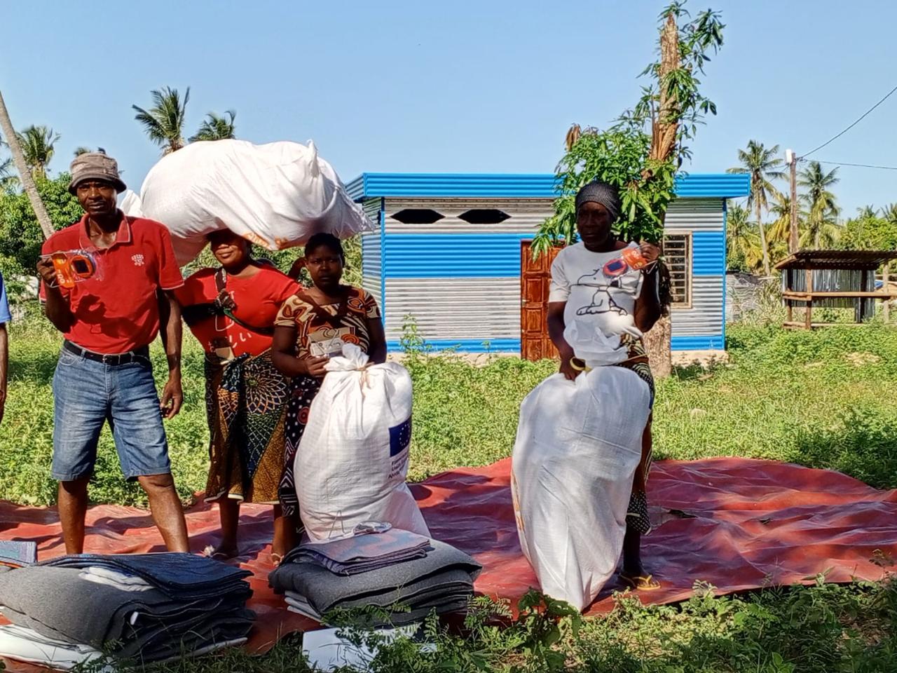 CARE distribution of NFI kits, including blankets, tarps, mosquito nets, mats and lamps, Morrumbene, Inhambane