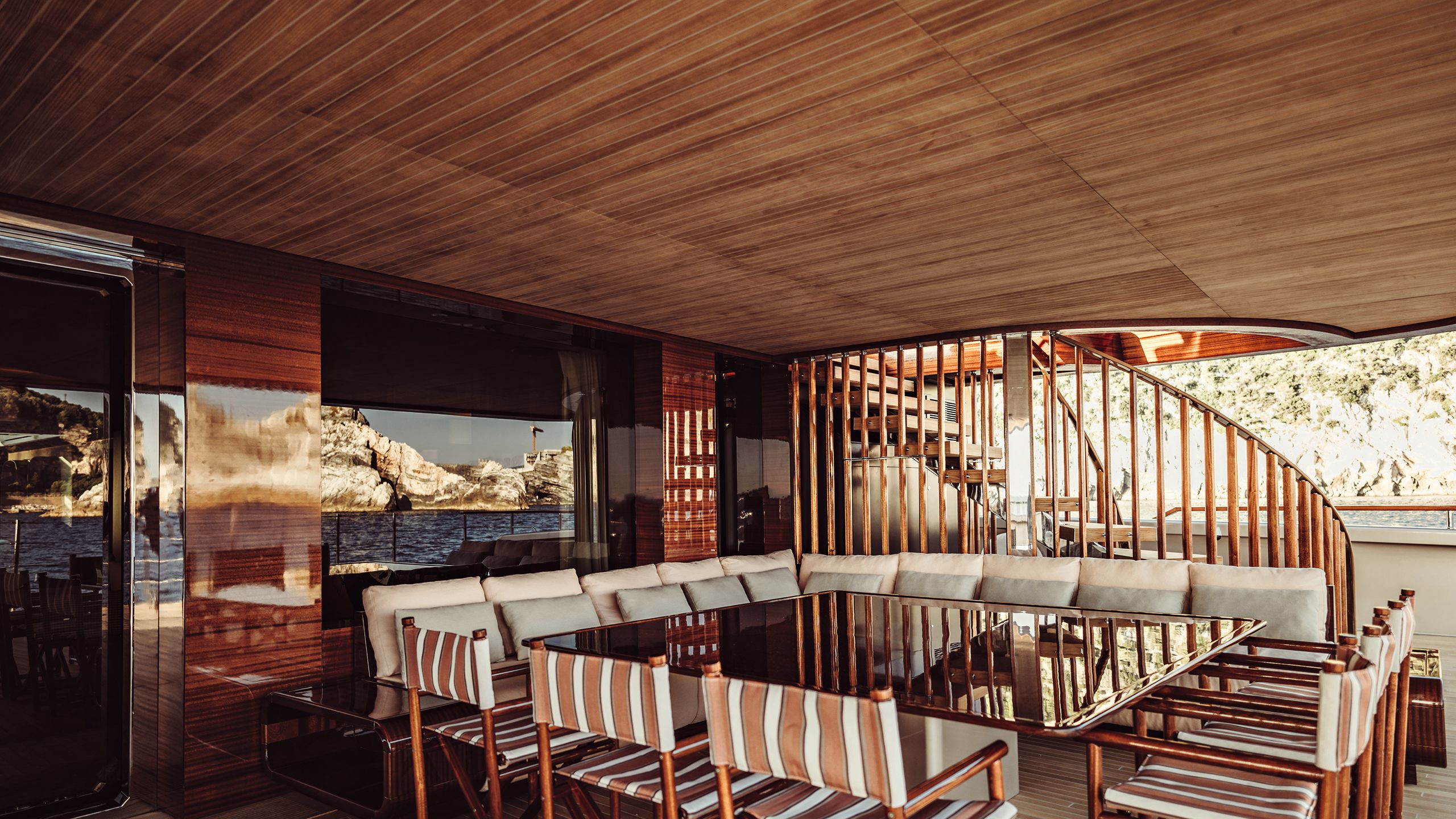 Dining table and chairs in covered area of deck