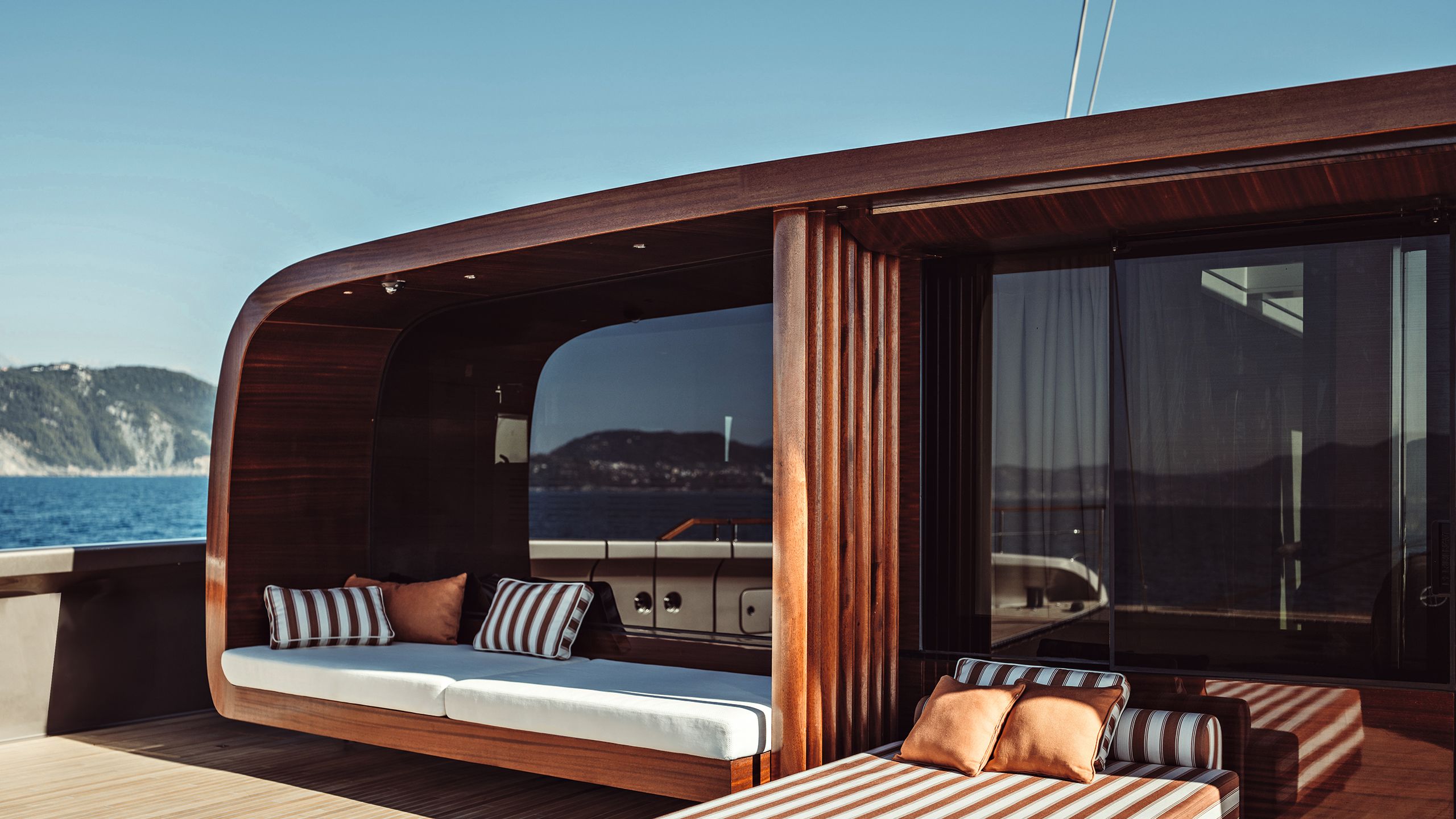 Striped sun loungers on deck